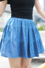 Load image into Gallery viewer, TIERED FLARE MINI RUFFLE SKORT IN DENIM
