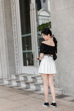 Load image into Gallery viewer, DORA PLEATED SKORTS IN WHITE
