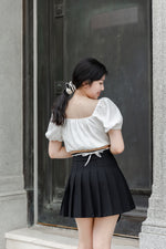 Load image into Gallery viewer, DORA PLEATED SKORTS IN BLACK
