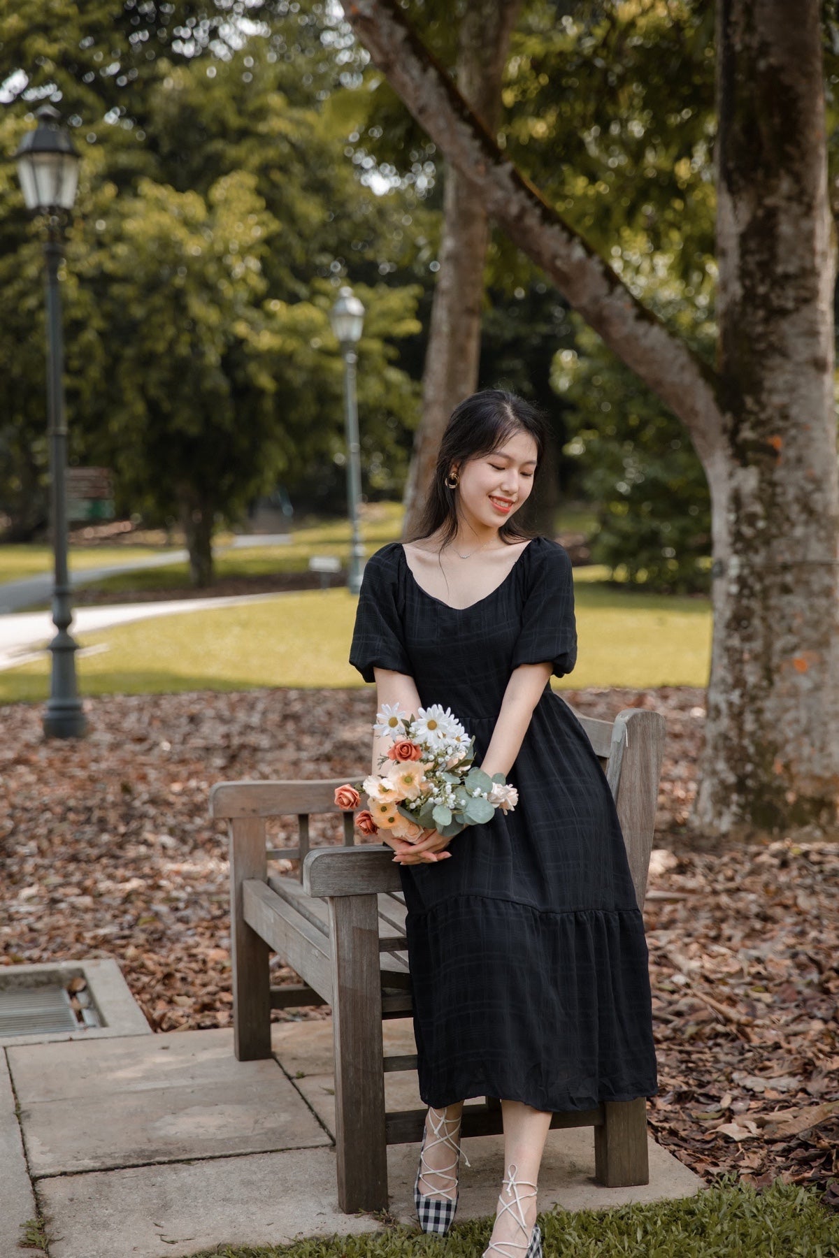 BERENICE TEXTURED PUFF SLEEVE MIDI DRESS IN BLACK