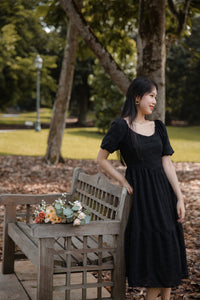 BERENICE TEXTURED PUFF SLEEVE MIDI DRESS IN BLACK